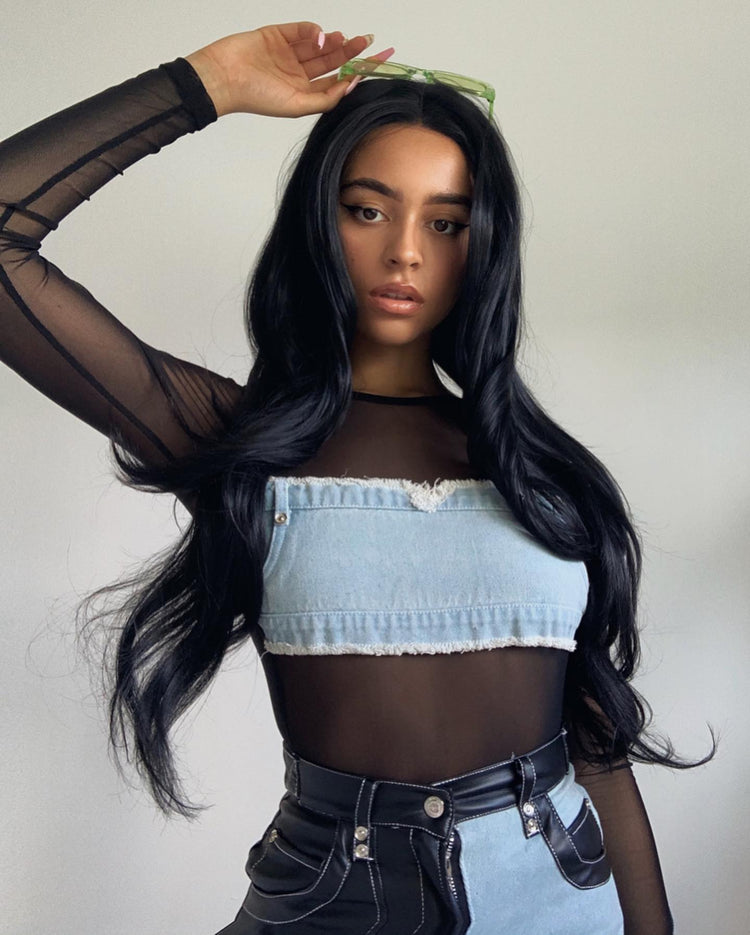 Image of a variety of black wigs with different textures, showcasing the 'Black Wigs' collection featuring glossy straight hair and voluminous curls. Mirrorpass.com